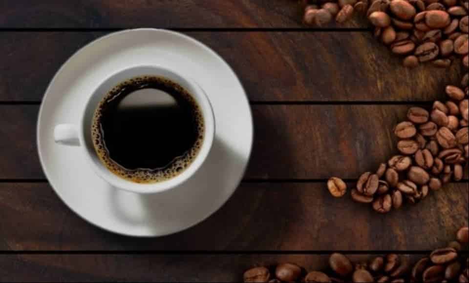 Cup of decaf coffee with coffee beans Cup of decaf coffee with coffee beans